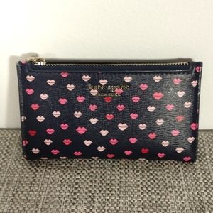 Kate Spade slim bifold wallet w/ lips pattern